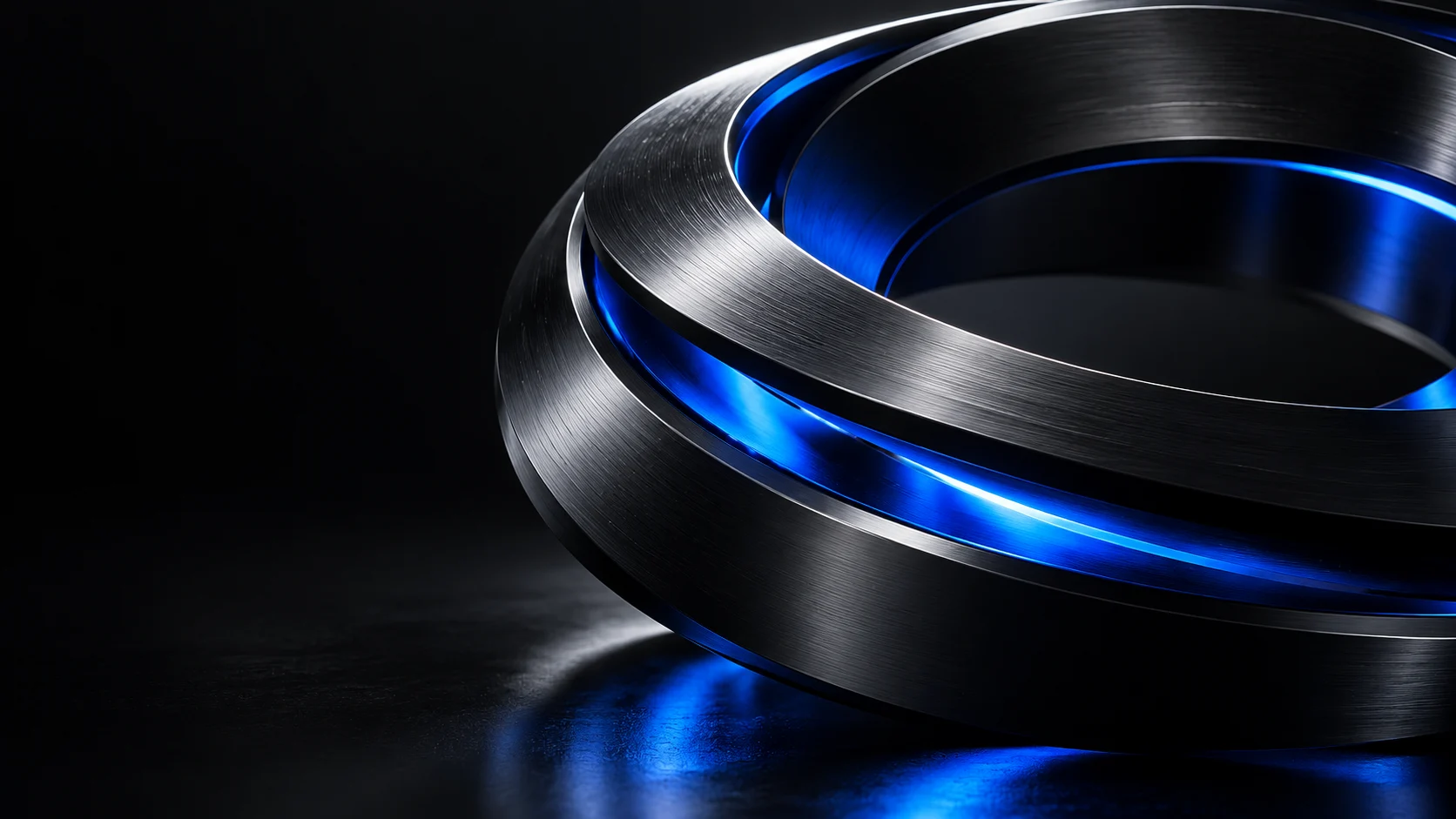 Precision titanium sculpture illuminated by electric blue light